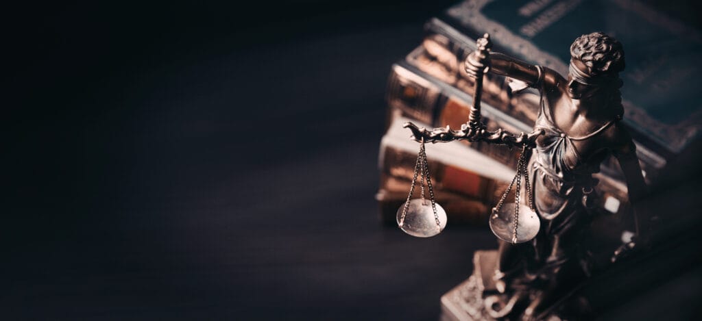 Lady Justice statue with scales and gavel representing Maryland legal services and law firm expertise